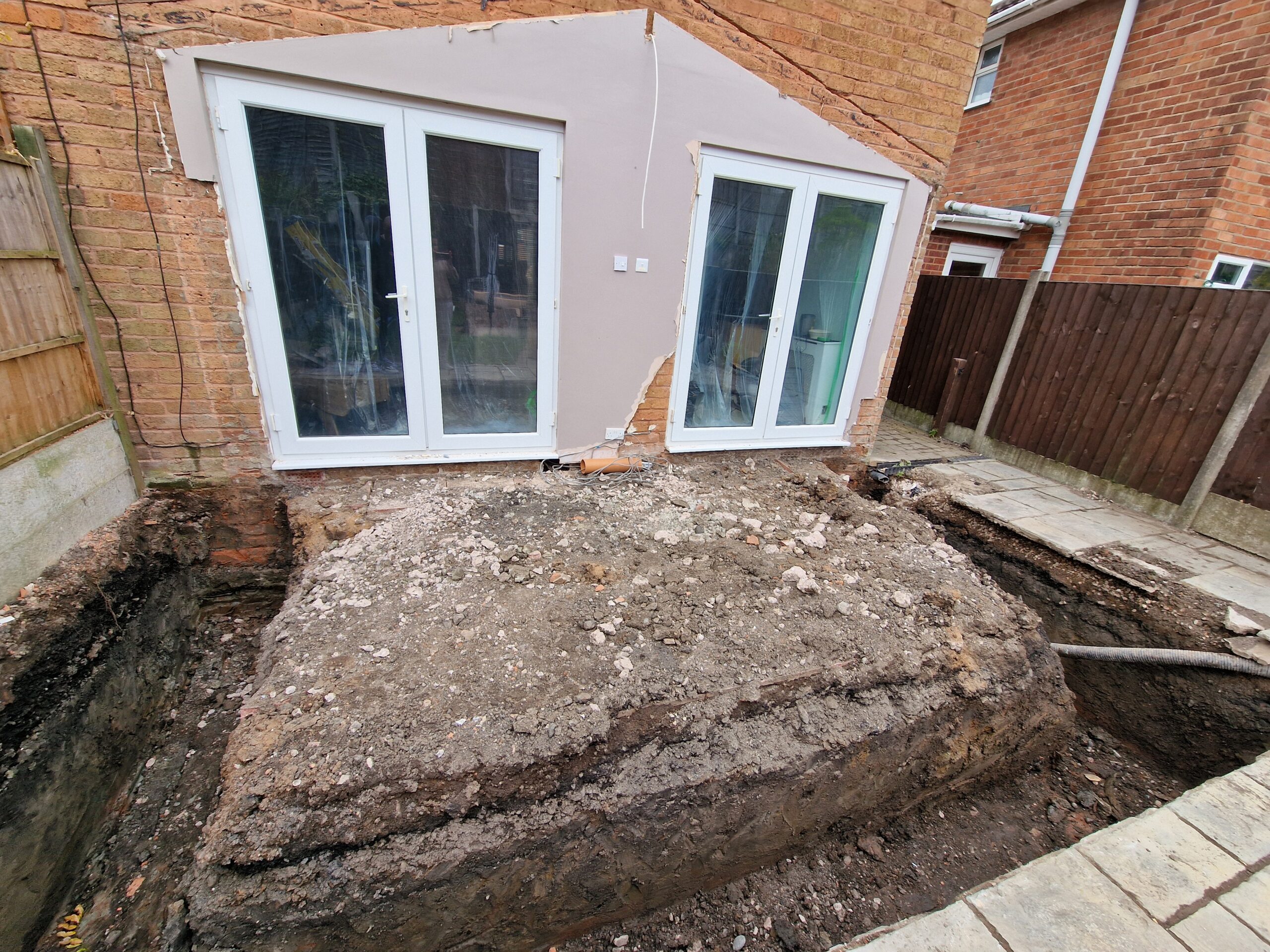 Kings Norton Extension works progress picture showing house in Birmingham deconstructed extension and new foundations being set | ID Property Developments