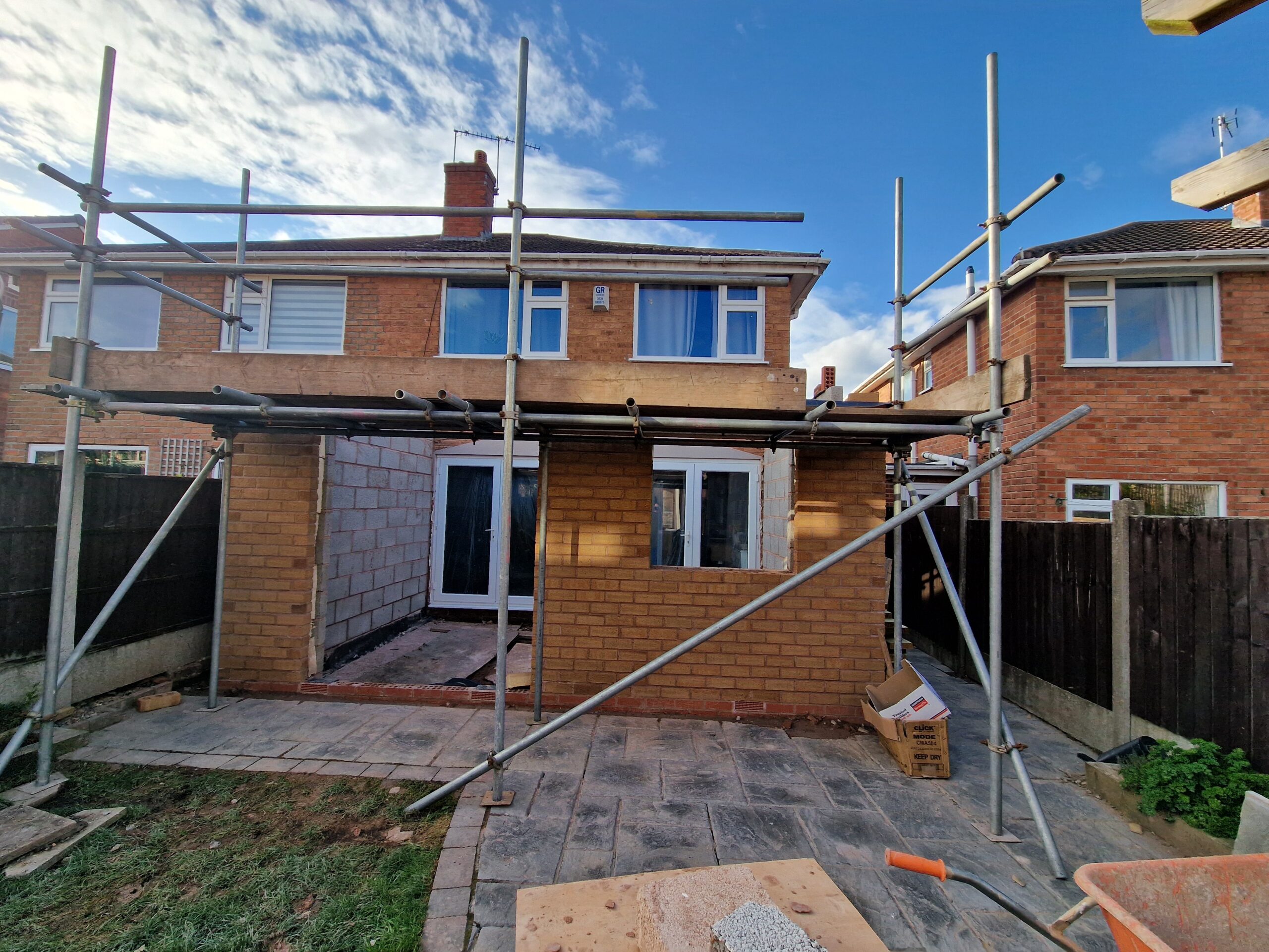 Kings Norton Extension works progress picture showing house in Birmingham with new brickwork and scaffolding | ID Property Developments