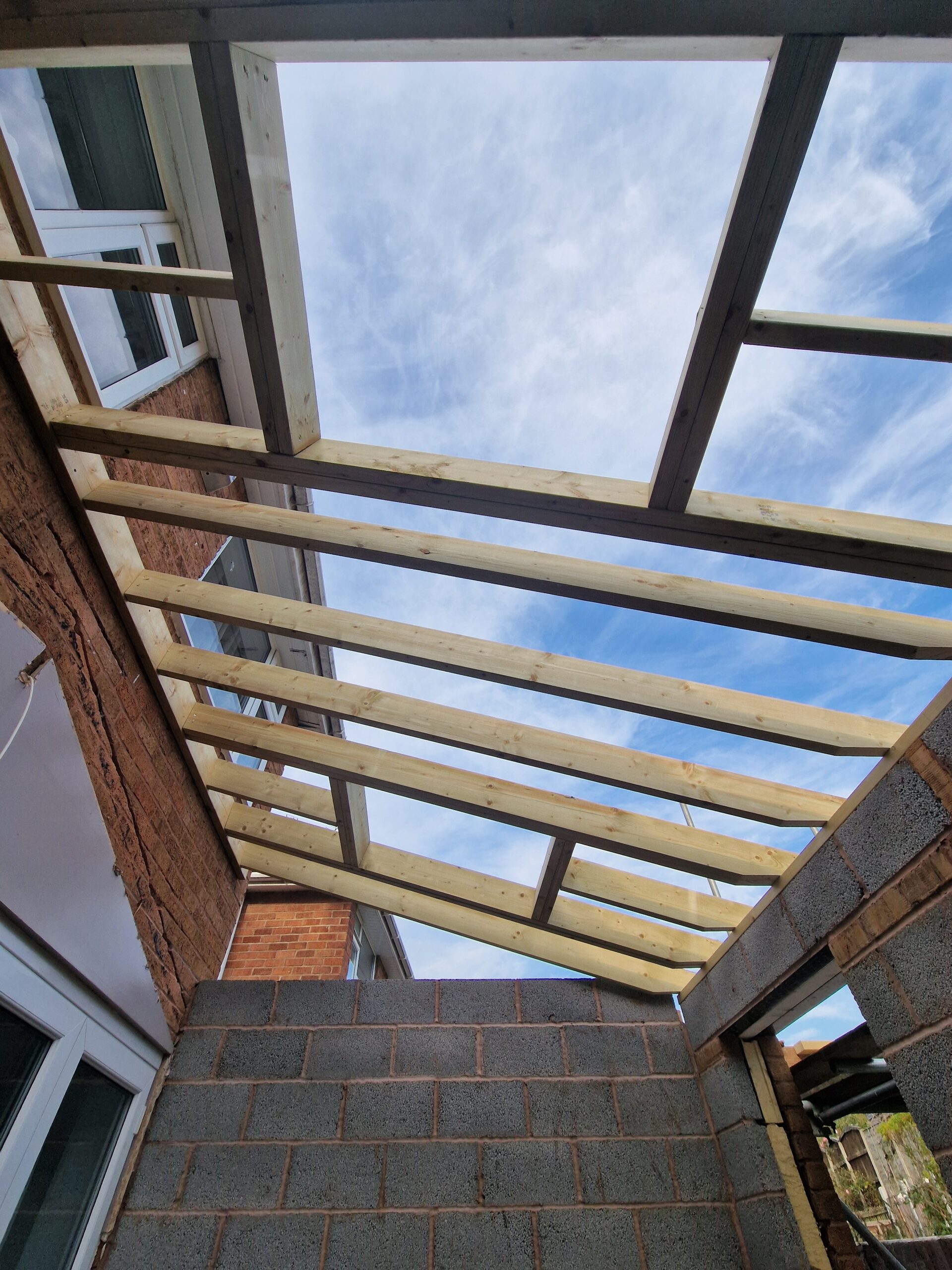 Kings Norton Extension works progress picture showing house in Birmingham with new brickwork and roof | ID Property Developments