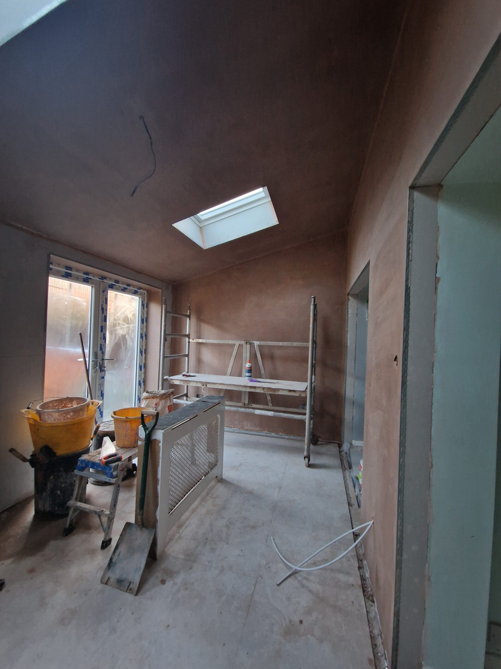 Kings Norton Extension works progress picture showing house in Birmingham with newly plastered interior | ID Property Developments