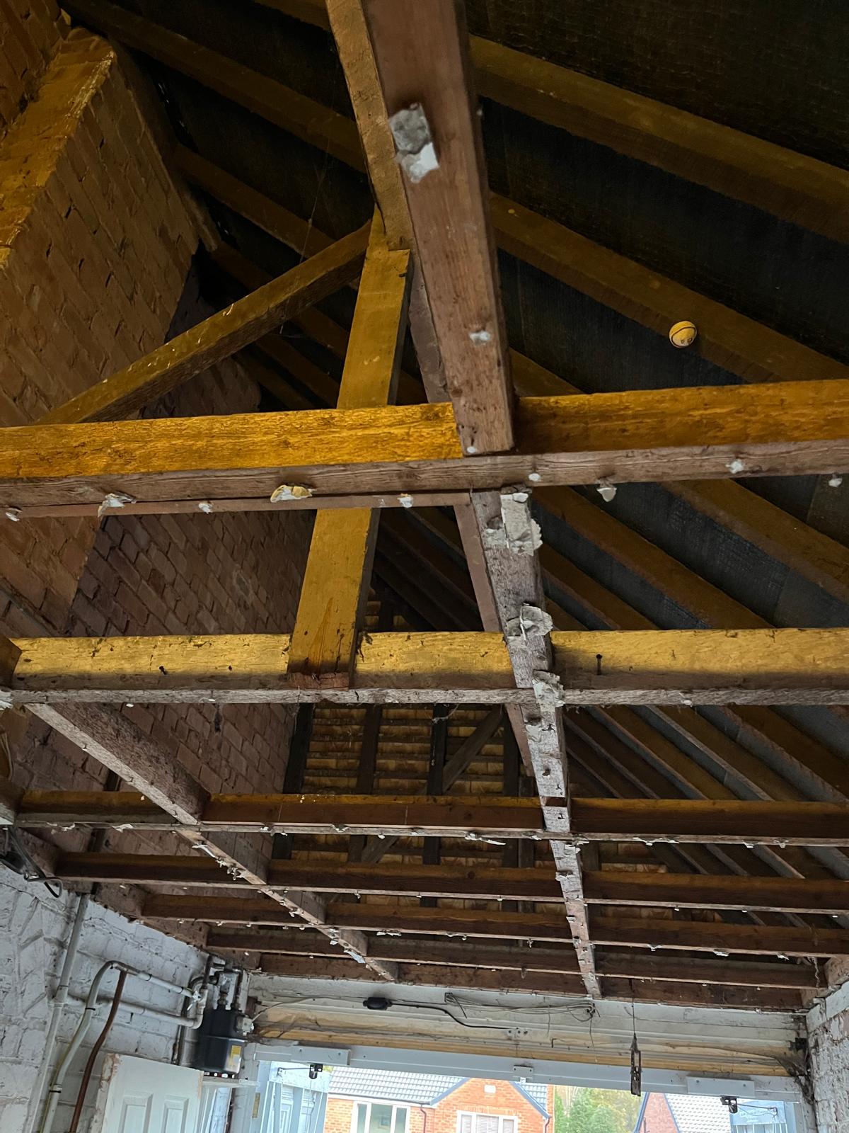 mid-project roof stripped before raising celining and installing skylights Garage Conversion - Cofton Hackett - ID Property Developments