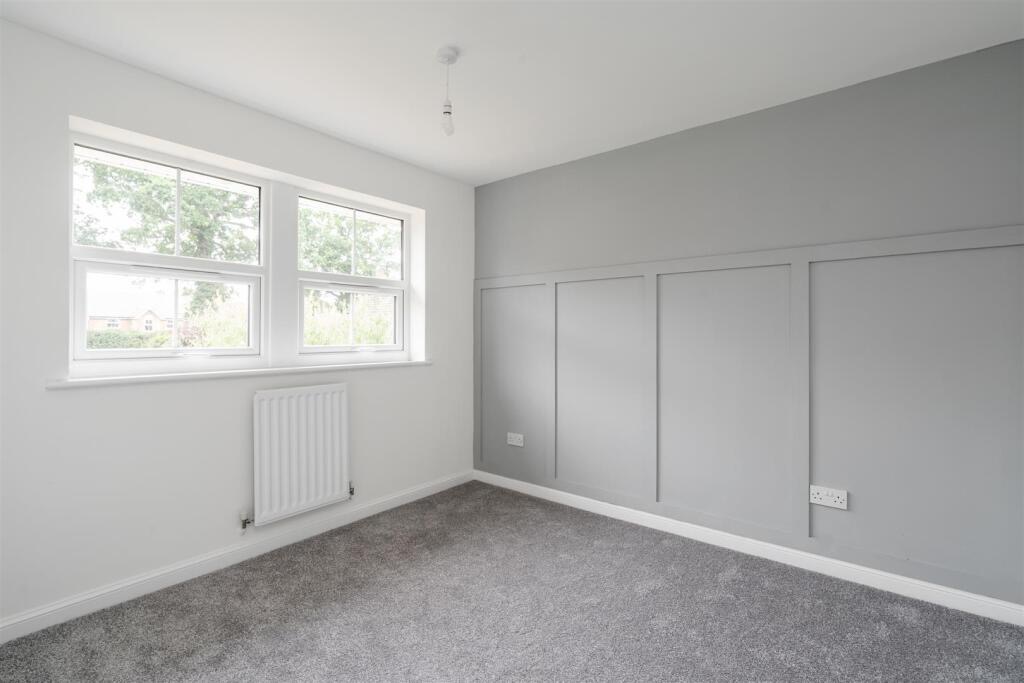Renovated property in Dorridge - light and airy bedroom with wall panelling