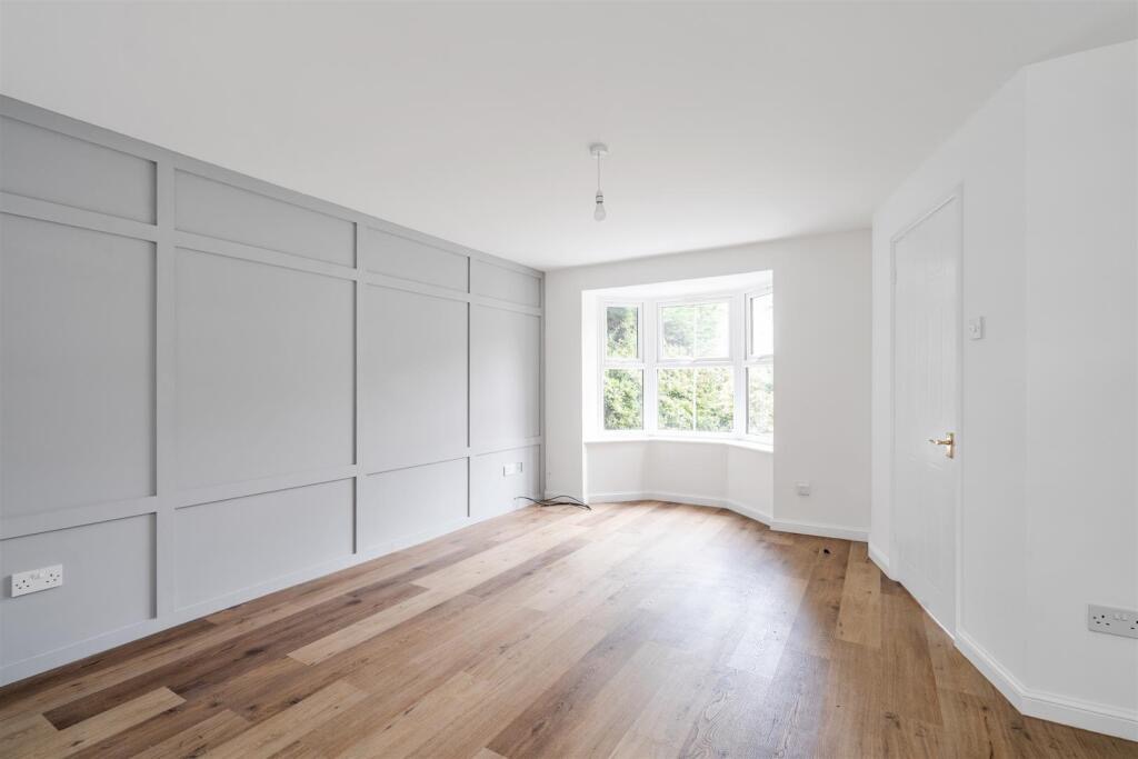 Renovated property in Dorridge - light and airy living room with wall panelling