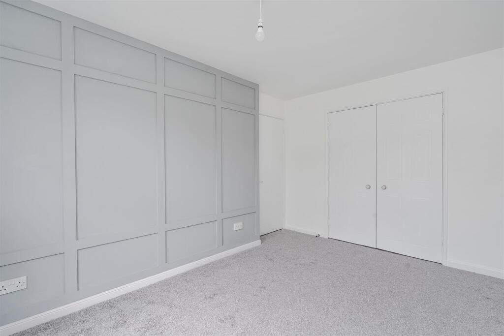 Renovated property in Dorridge - light and airy bedroom with wall panelling