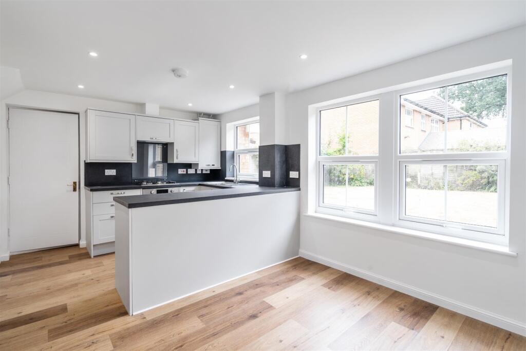 Renovated kitchen-diner in Dorridge home showing new flooring, walls, and finish.